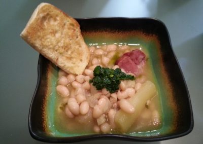 Beans, ham hock broth, yucca root, cilantro pesto